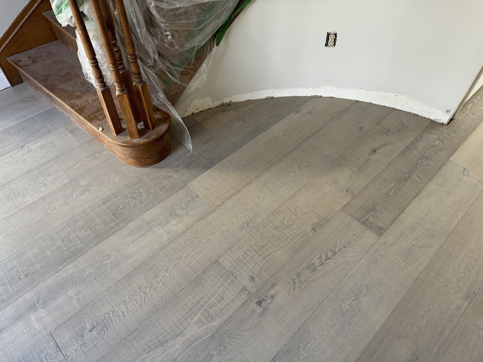 Gray hardwood at curved stair