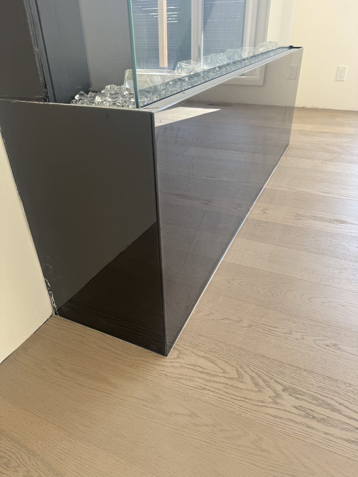 Hardwood scribed to fireplace