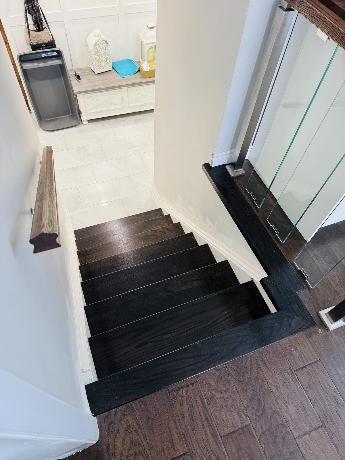 Dark stairs with glass-rail landing